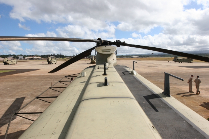 The top of the CH-47F looking forward from the Combining Transmission area. Visible on the Tunnel Covers are the GPS Antennas and the new Satellite Communication (SATCOM) System Antenna (looks like an eggbeater).