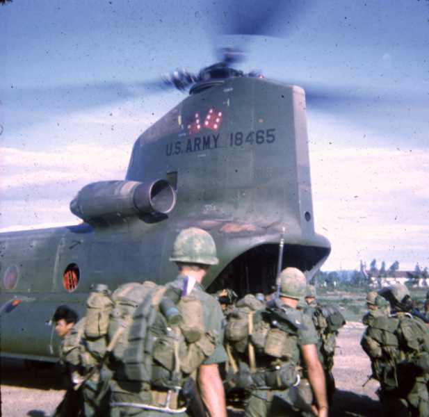 Soldiers from B Company, 1st Battalion, 6th Infantry Division, load onto 67-18465 - a CH-47B Chinook helicopter from the 178th Assault Support Helicopter Company (ASHC). Operating in the Republic of Vietnam (RVN), the helicopter was preparing to transport the troops from LZ Dottie to Hill 43 (east of LZ Dottie) in September 1970. The 178th ASHC unit callsign was the "Boxcars", and the pair of dice on the aft pylon was their distinctive emblem.