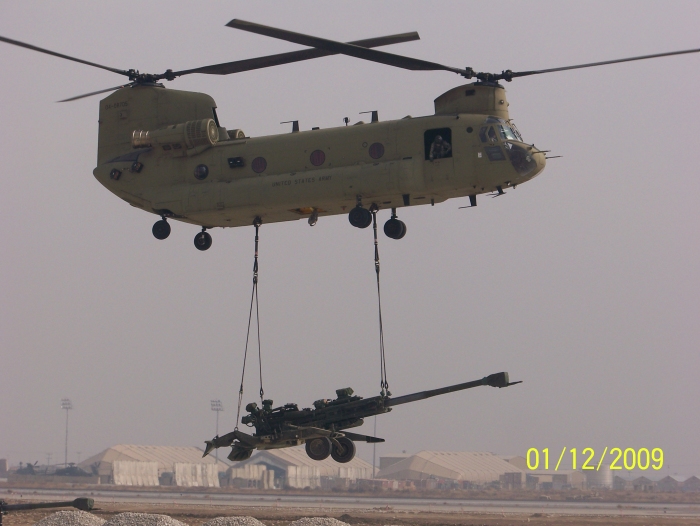 12 January 2009: CH-47F Chinook helicopter 04-08705 slinging a new M-777 Howitzer at Bagram Air Base in Afghanistan.