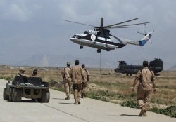 An MI-26 Halo helicopter moves MH-47E Chinook helicopter 92-00476, March 2002.