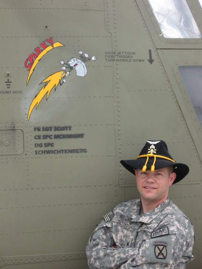 SGT Sidney Scott, Flight Engineer of 08-08056, poses beside his aircraft while it was assigned to B Company, 6-6 CAV in theater.