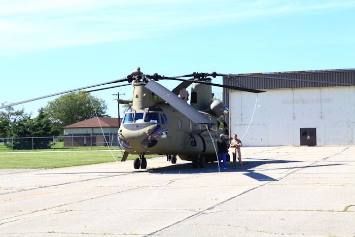 19 September 2012: Russ Stark and Wade Cothron complete the postflight/preflight of 10-08804 after arriving at Gus Grissom Joint Civil/Military Air Reserve Base at the end of the mission day. Down below, Barry Elsholz and Tim Coffman discuss the events of the trip so far. Tim, a Standardization Instructor with the NET Team, was the ground support coordinator at Grissom and ensured the flight crews had a room and transporation during their brief overnight stay.