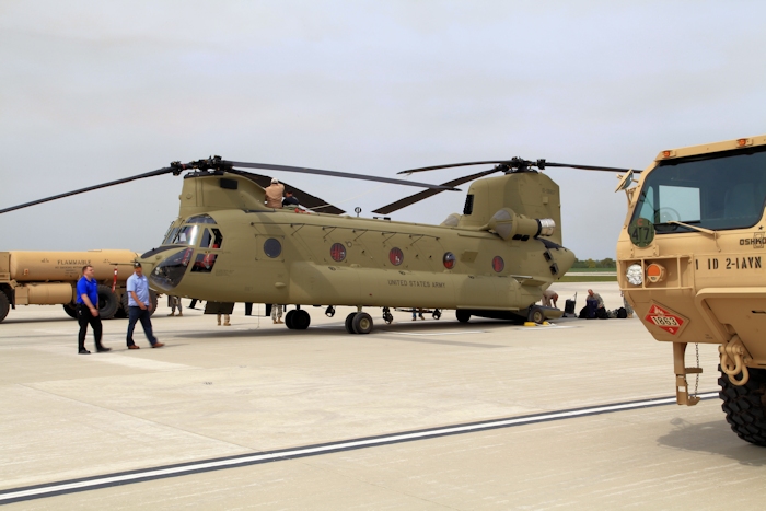 20 September 2012: CH-47F Chinook helicopter 10-08807 after landing at Marshall Army Airfield (KFRI). NET Team member Bill cagle helps tie down the blades (on top) while the pilots, Brock Tedrick and Kevin Jordan (near the ramp) pack up their gear. The Ferry Flight Mission is complete.