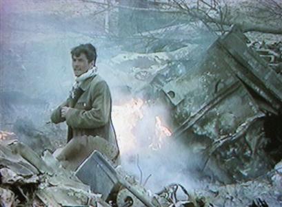 An Afghan inspects the wreckage of a U.S. military CH-47D Chinook helicopter.