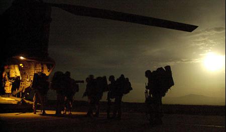 British Royal Marines board a helicopter in Afghanistan.