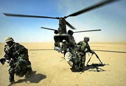 An RAF HC Mark II Chinook helicopter drops Marines of the 15th Expeditionary Unit (MEU), Fox Company - "Raiders", at an undisclosed location in the Iraqi desert on 28 March 2003.