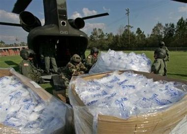 Ohio National Guardsmen unload ice from the cargo hold of a Chinook helicopter after landing in a rural area to assist victims of Hurricane Katrina in Mississippi on Thursday.