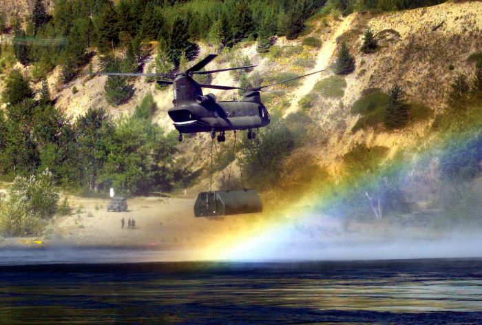 90-00224, a CH-47D Chinook assigned to the Washington Army Reserve, transports a bridge section in British Columbia.